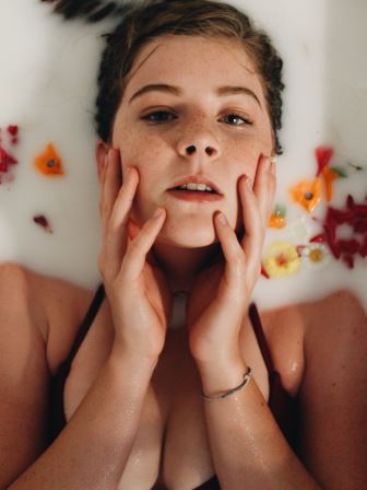 woman washing face